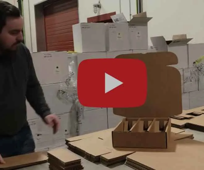 Matt-building-boxes-for-wine-club-shipments https://wintershillwine.com/story/its-wine-club-season-at-winters-hill/